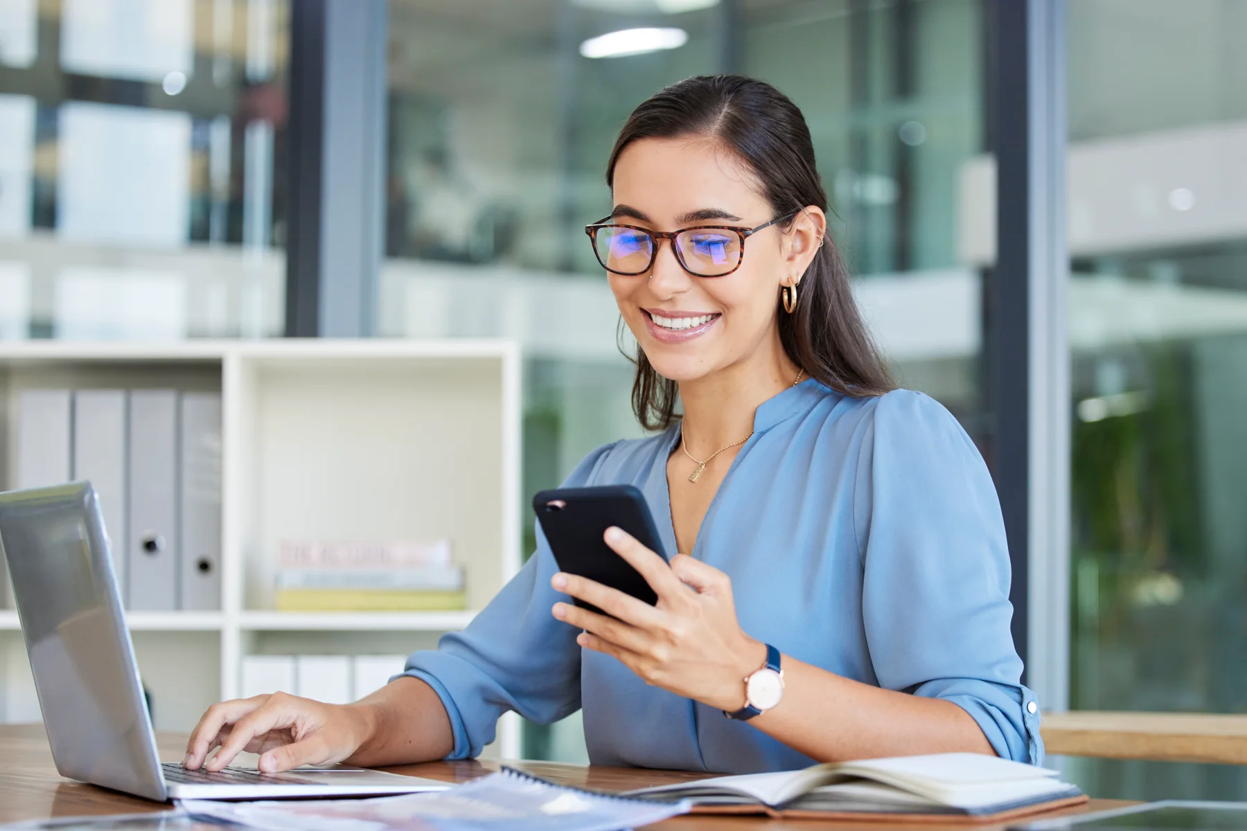 Business owner reviewing customer information and next steps on a phone