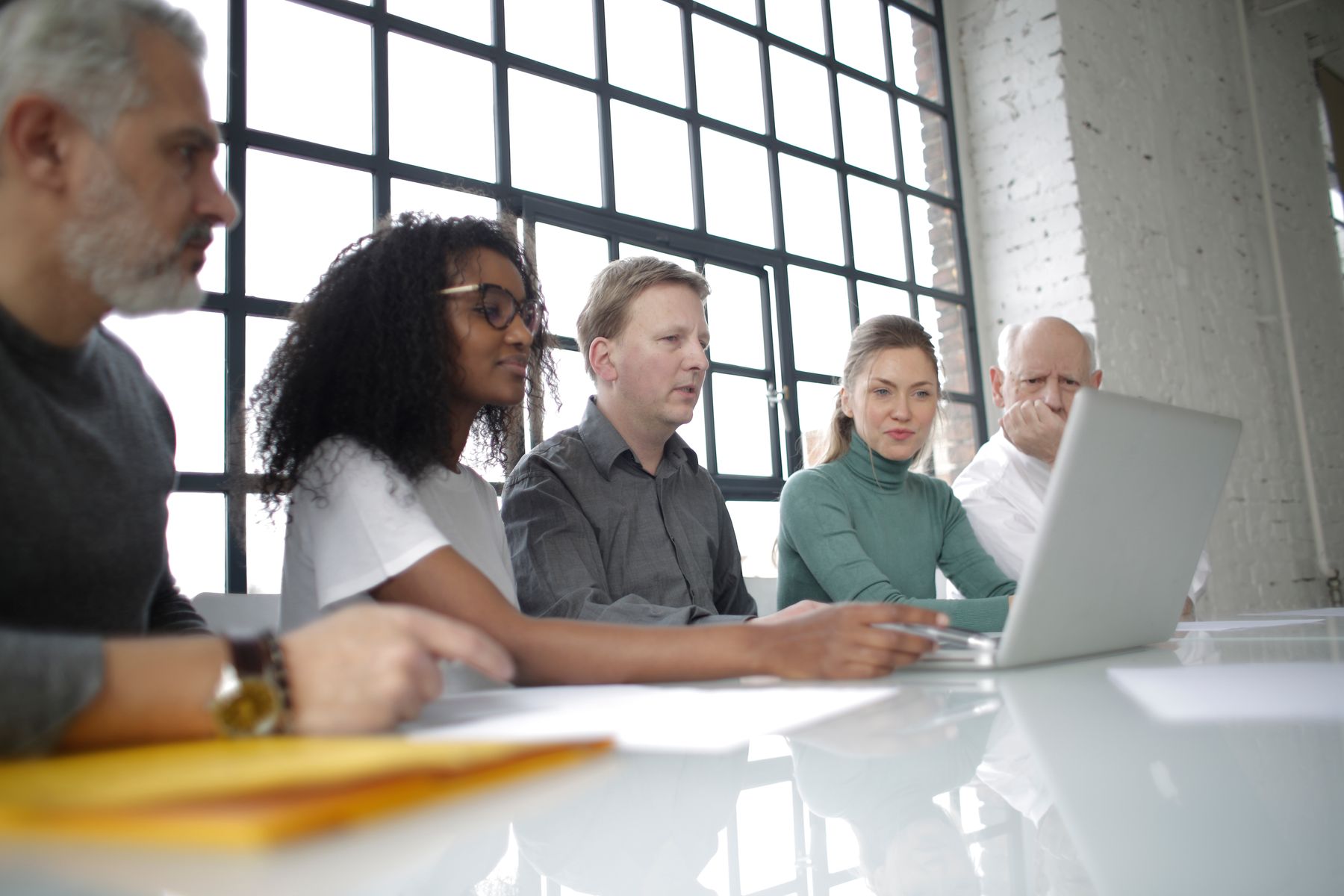 A small business team reviewing a digital process together